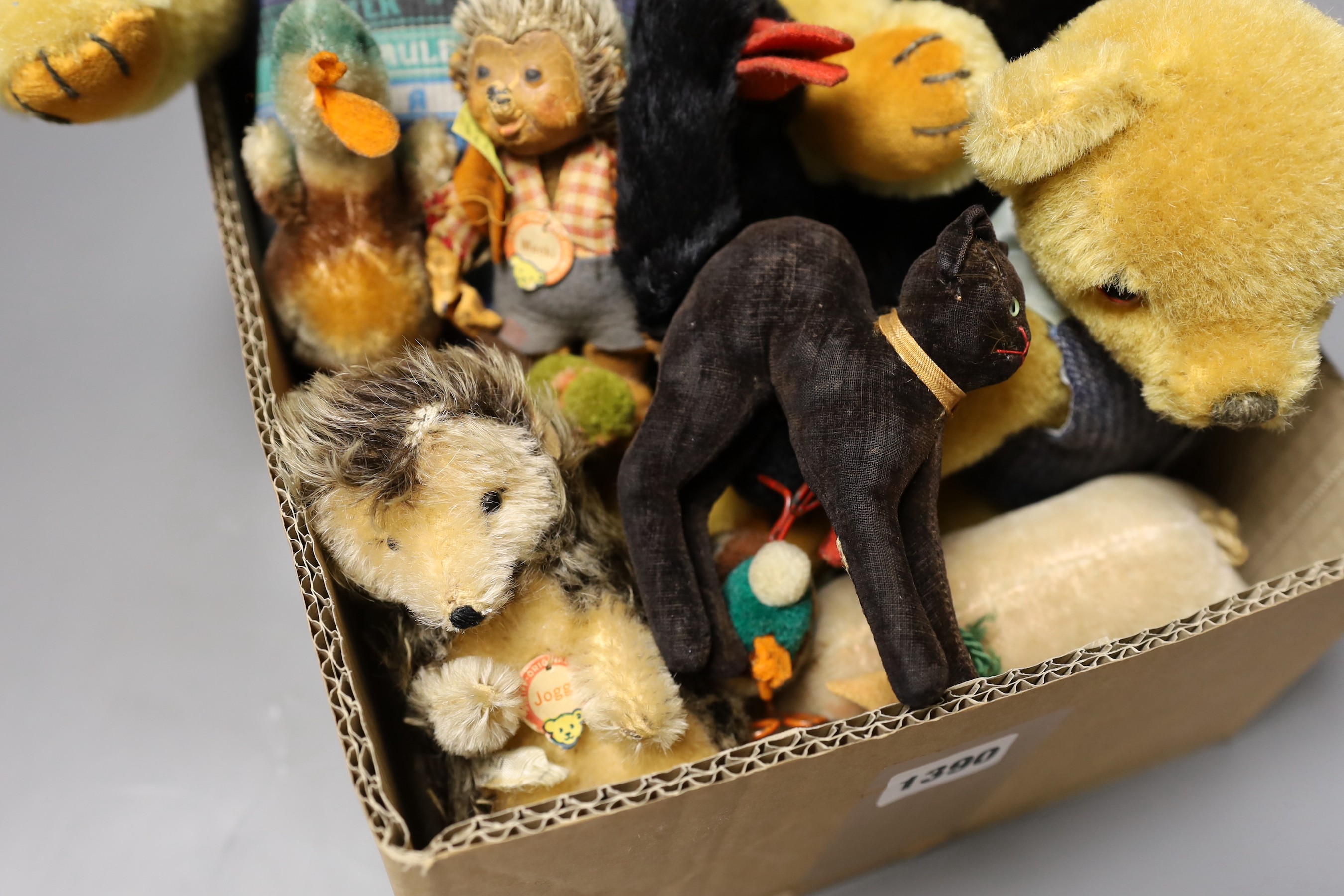 A collection of Steiff toys - a small black cat, a large black cat, a small pig, a hedgehog, a Macki hedgehog, two crows, a duck, two small birds with wire feet and two Peter Bull bears with pedigree certs. (12)